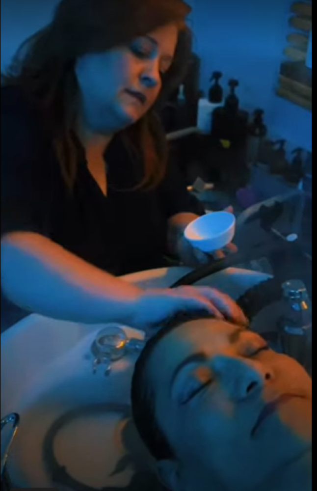 Cheree applying a scalp treatment to prevent premature hairloss.